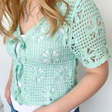Mint crochet cropped sweater with three ties in the front. Perfect for layering over a tank or dress.