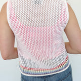 White sweater tank top with rainbow colors around the bottom. Button up. Layered with tank top underneath.