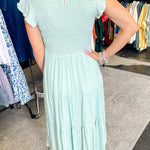 Smocked top dress with short sleeves. Ruffle sleeves. Midi length with tiers. 