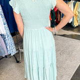 Smocked top dress with short sleeves. Ruffle sleeves. Midi length with tiers. 