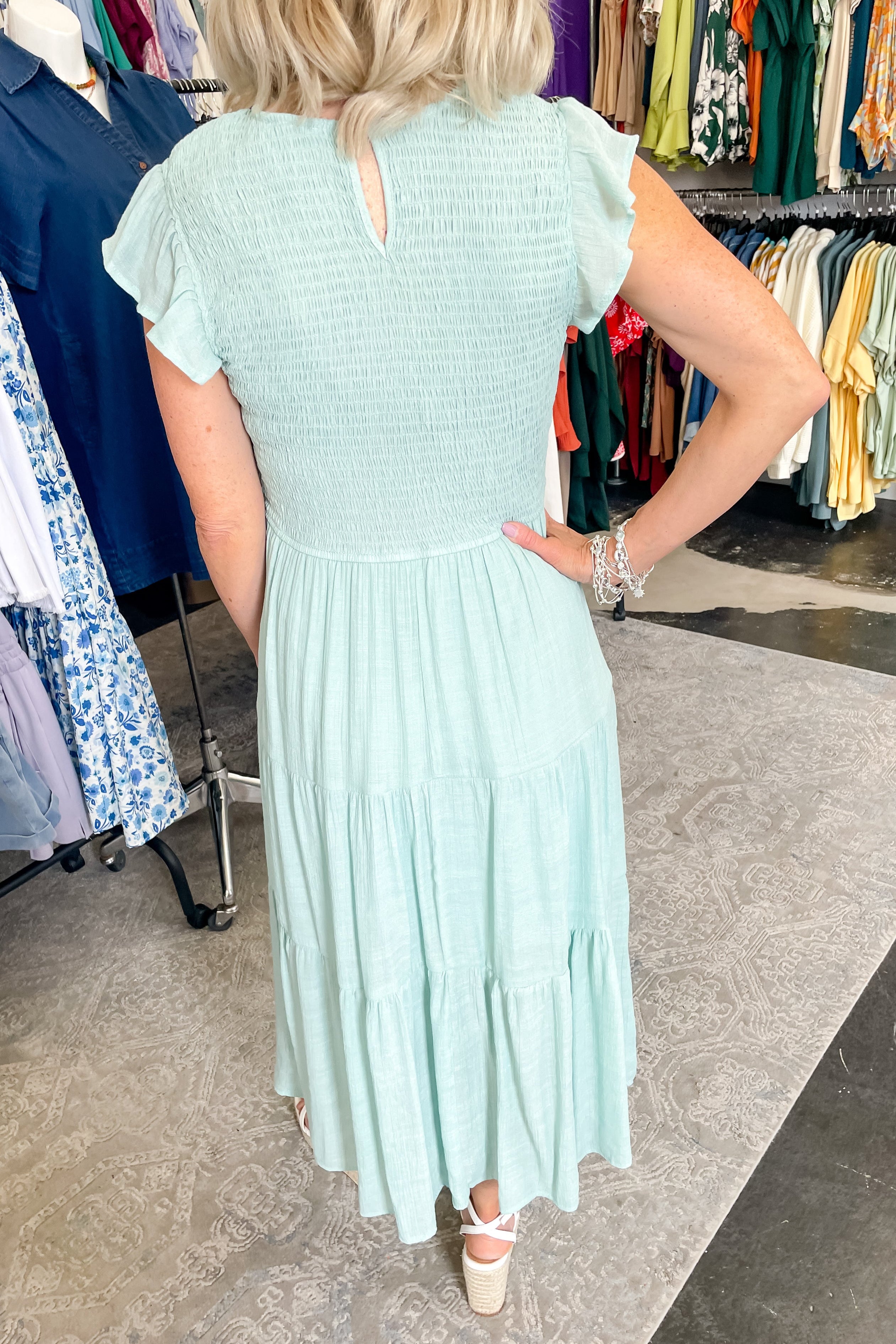 Smocked top dress with short sleeves. Ruffle sleeves. Midi length with tiers. 