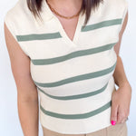 Sweater tank with collar and small v neckline. Cream with olive horizontal stripes. Regular fit. 