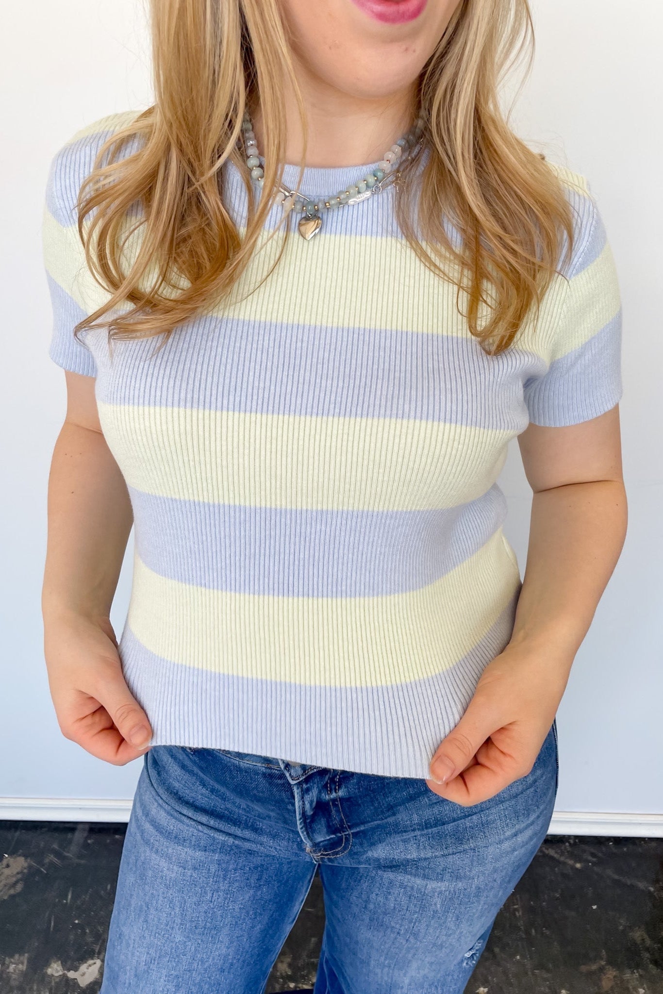 Blue and cream striped sweater top. High neckline. Slightly cropped style.