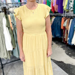 Smocked top dress with short sleeves. Ruffle sleeves. Midi length with tiers. 