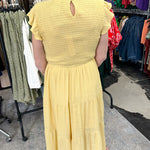 Smocked top dress with short sleeves. Ruffle sleeves. Midi length with tiers. 