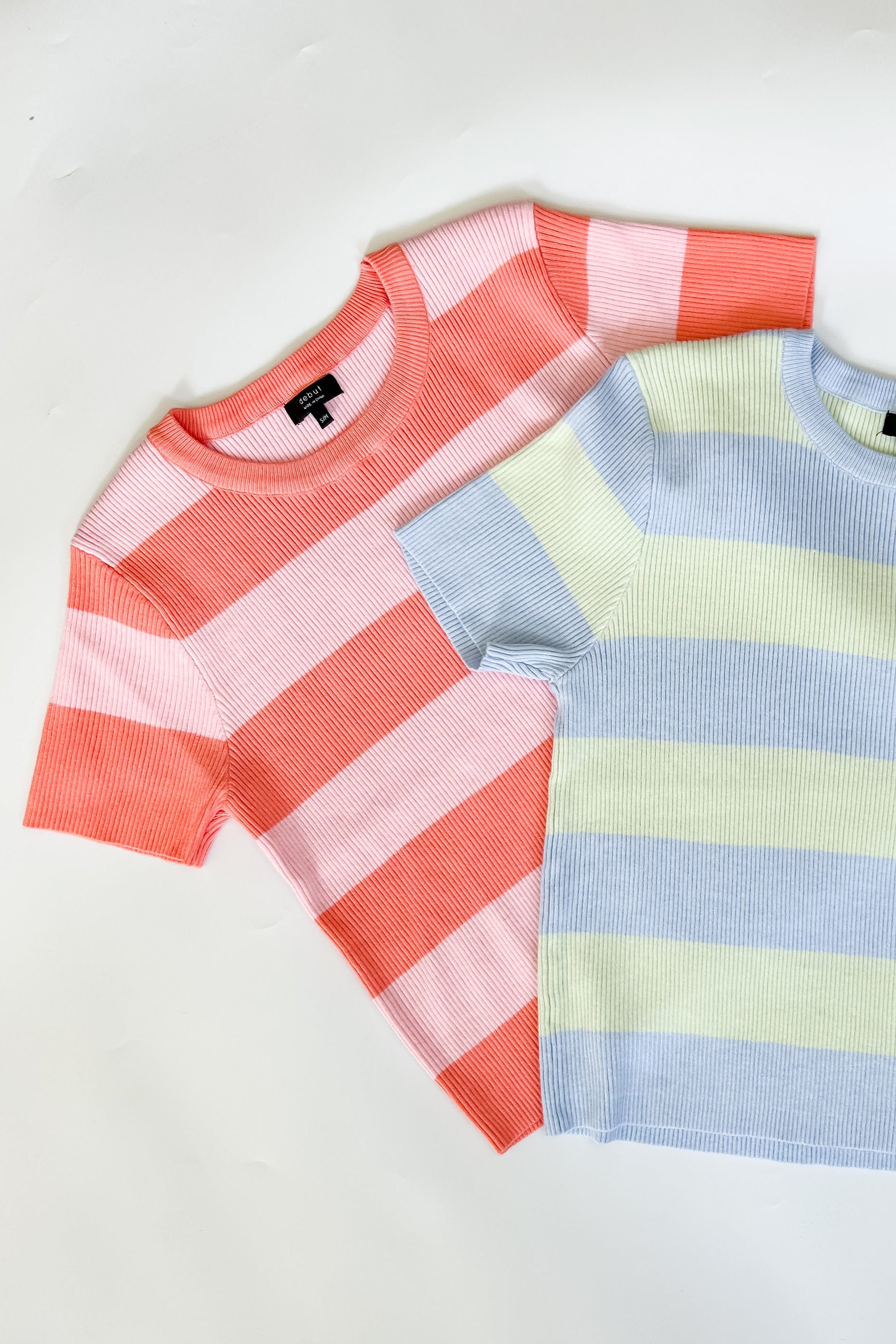 Pink and coral toned striped sweater. High neckline. Slightly cropped fit. Short sleeve style.