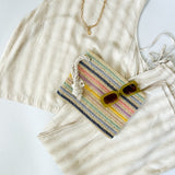 Striped tank and matching pants set. High neckline on top and regular fitting pants. Elastic waistline with tie.  White and tan in color.