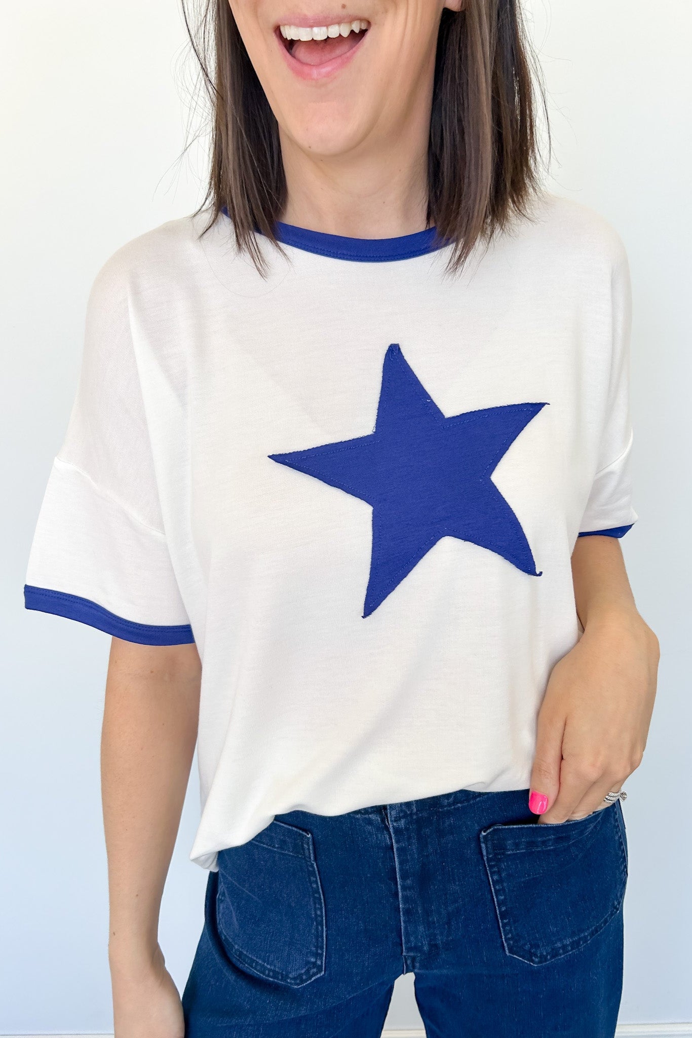 Ringer tee with a royal blue round neckline and a royal blue star. Slightly oversized fit. 