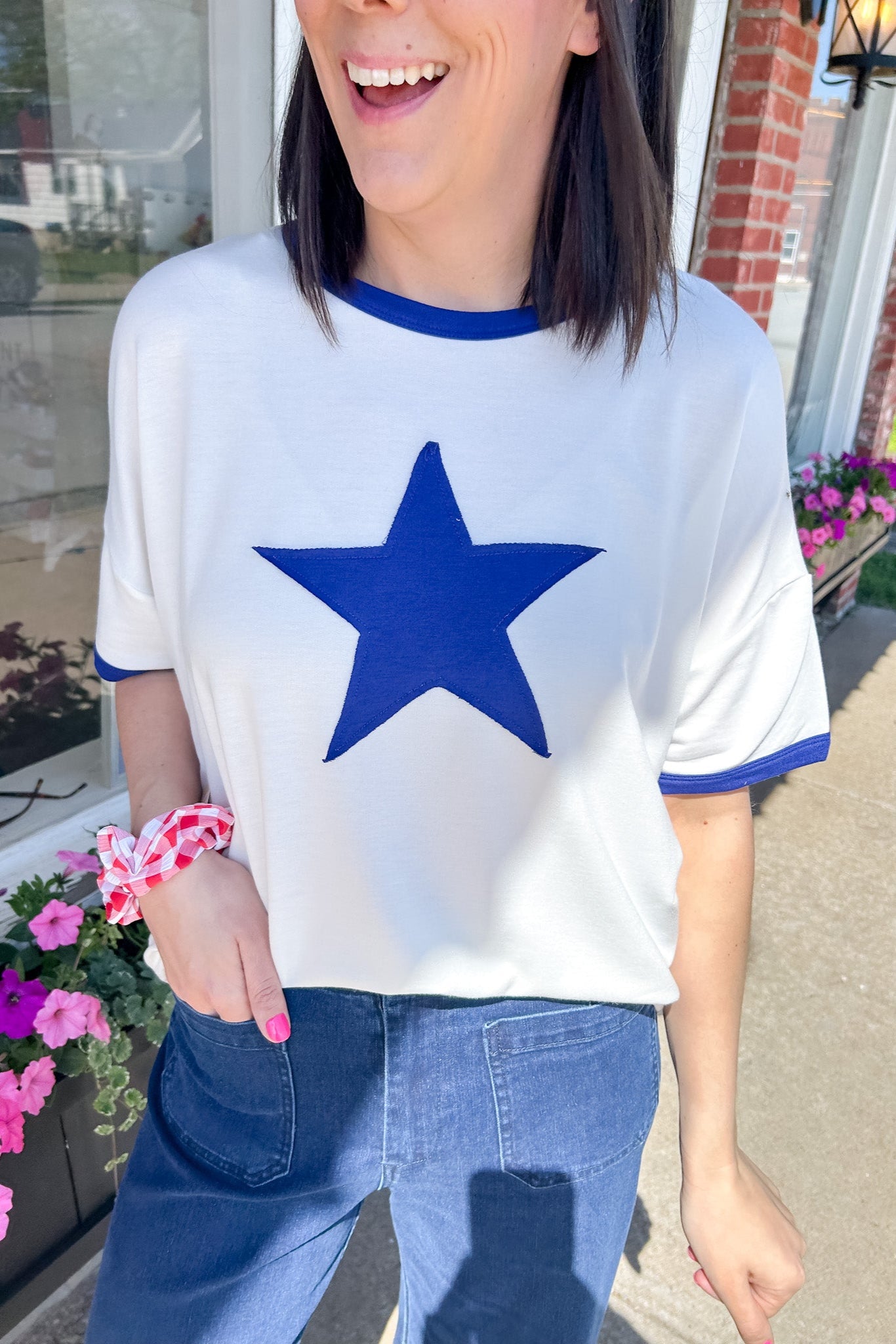 Ringer tee with a royal blue round neckline and a royal blue star. Slightly oversized fit. 