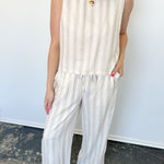 Striped tank and matching pants set. High neckline on top and regular fitting pants. Elastic waistline with tie.  White and tan in color.