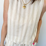 Striped tank and matching pants set. High neckline on top and regular fitting pants. Elastic waistline with tie.  White and tan in color.