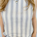 Striped tank and matching pants set. High neckline on top and regular fitting pants. Elastic waistline with tie.  White and blue in color.