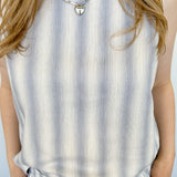 Striped tank and matching pants set. High neckline on top and regular fitting pants. Elastic waistline with tie.  White and blue in color.