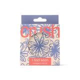 Compact mirror with floral design packaging on a white background