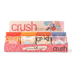 Display of Crush products with colorful packaging on a white background