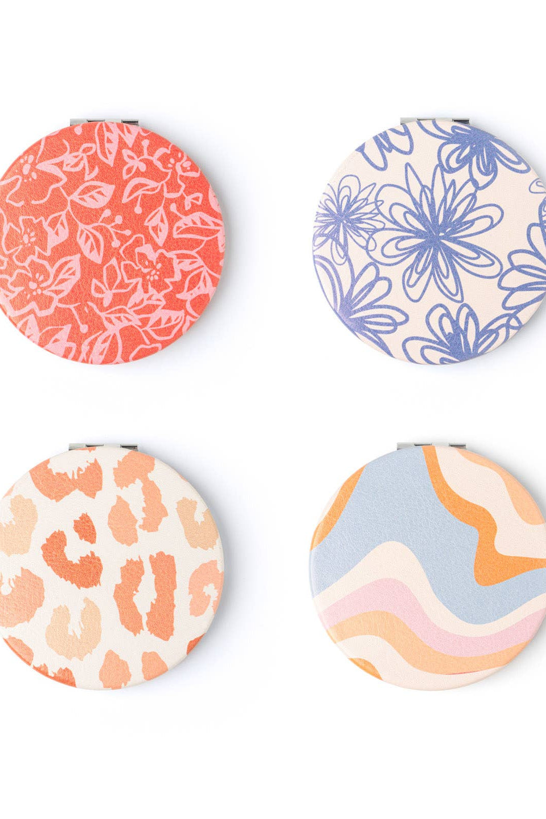 Four round coasters with floral, abstract, and animal print designs on a white background.
