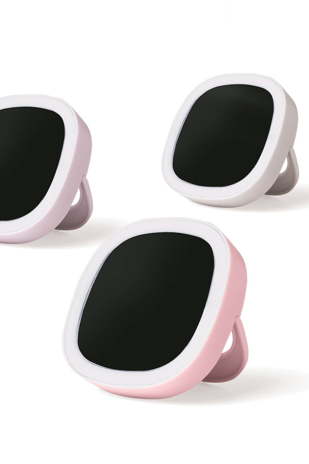 Three black circular devices with pink and white frames on a white background