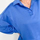 Person wearing a blue shirt with a white background