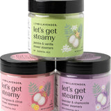 Three jars of 'let's get steamy' shower steamers with colorful labels on a white background.