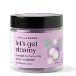 Jar of 'let's get steamy' lavender and chamomile shower steamers on a white background