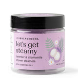 Jar of 'let's get steamy' lavender and chamomile shower steamers on a white background