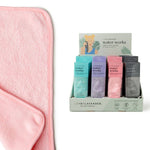 Pink towel with a display of colorful boxes labeled 'water works' on a white background