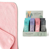 Pink towel with a display of colorful boxes labeled 'water works' on a white background