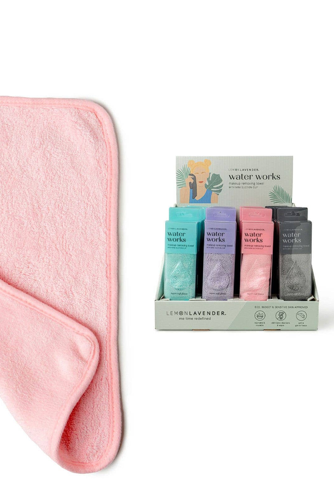 Pink towel with a display of colorful boxes labeled 'water works' on a white background