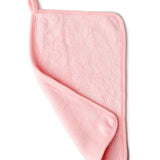 Pink towel with color swatches on a white background