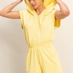 Creamy yellow hooded romper with a functional zipper and pockets. Comfortable and casual look. 