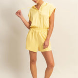 Creamy yellow hooded romper with a functional zipper and pockets. Comfortable and casual look. 