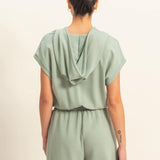 Sage green romper with functional zipper and pockets. Casual comfortable style.