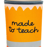 Orange pencil-shaped cup holder with 'made to teach' text on a white background