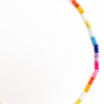Multicolored beaded necklace on a white background