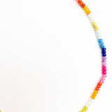Multicolored beaded necklace on a white background