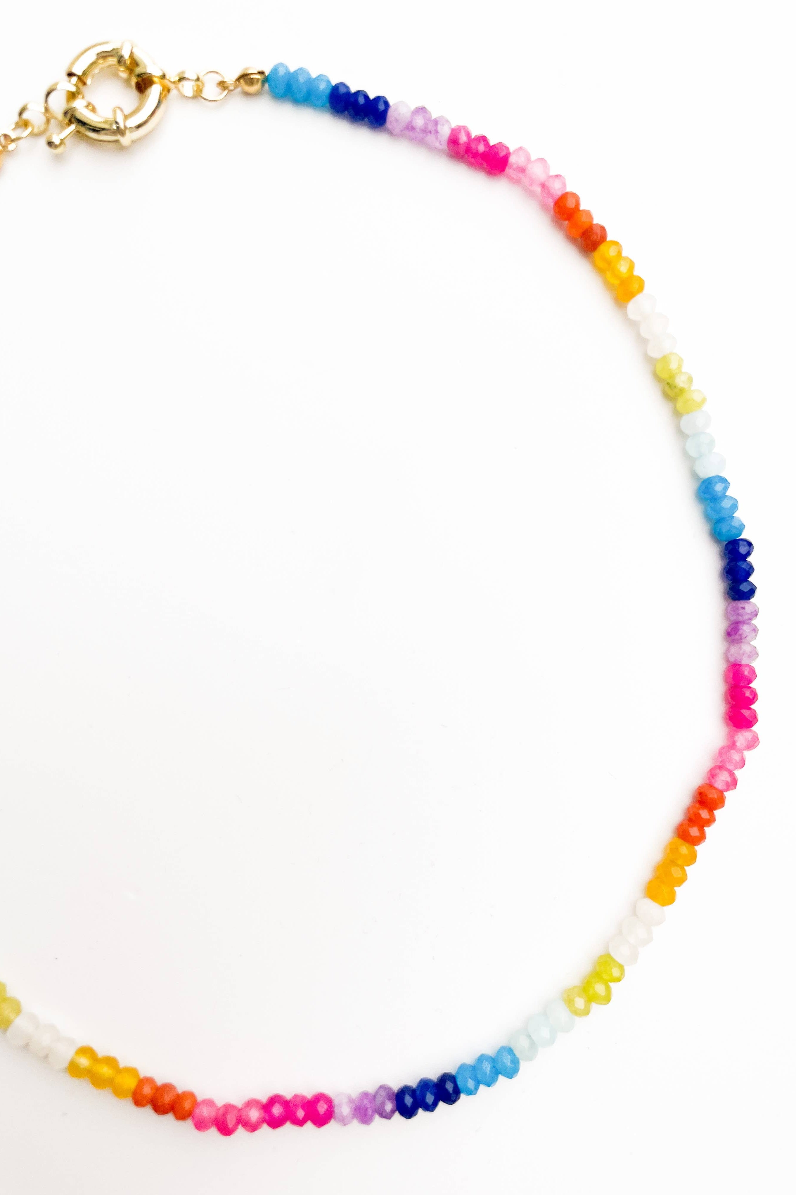 Multicolored beaded necklace on a white background