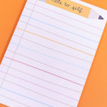 Note to self notepad with colorful border on an orange background