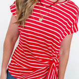Person wearing a red and white striped shirt with a white background