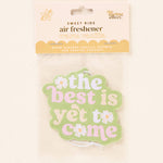 Air freshener with 'the best is yet to come' text on a light background