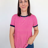 Woman wearing a pink and white striped shirt against a plain background