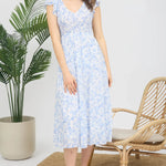 Floral print midi length dress. Blue and white in color. V neckline with flowy bottom and ruffles short sleeves.