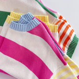Colorful striped sweaters on a white background