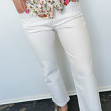 Photo of model wearing straight leg white denim pants 