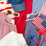 A pile of clothes that are red, white, and blue in color.