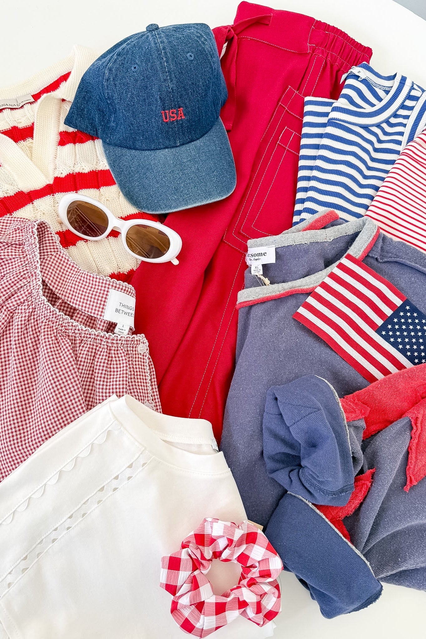 A pile of clothes that are red, white, and blue in color.