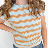 Person wearing a striped shirt with a plain background